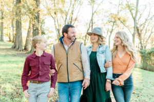 Family of four walking and smiling at each other, Southwest Point Kingston, TN