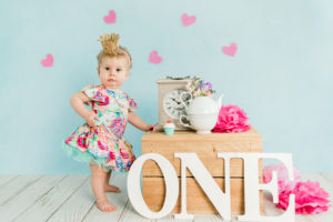 Baby girl in tea party themed first birthday studio session in Kingston