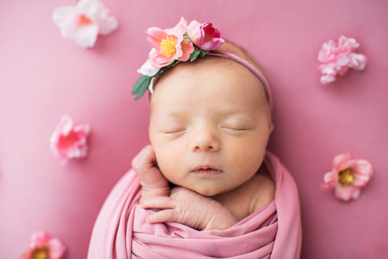 Newborn baby girl on pink floral backdrop, Knoxville TN newborn photography studio