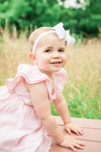 Close-up portrait of two-year-old girl Gracie outdoors, Knoxville family photography
