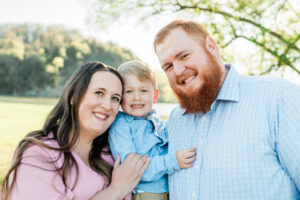 Nix family smiling at camera, Melton Hill Park Knoxville maternity session