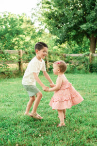 Siblings playing together outdoors, Knoxville family photography