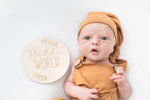 Newborn baby boy with hello world sign, Knoxville newborn photography studio