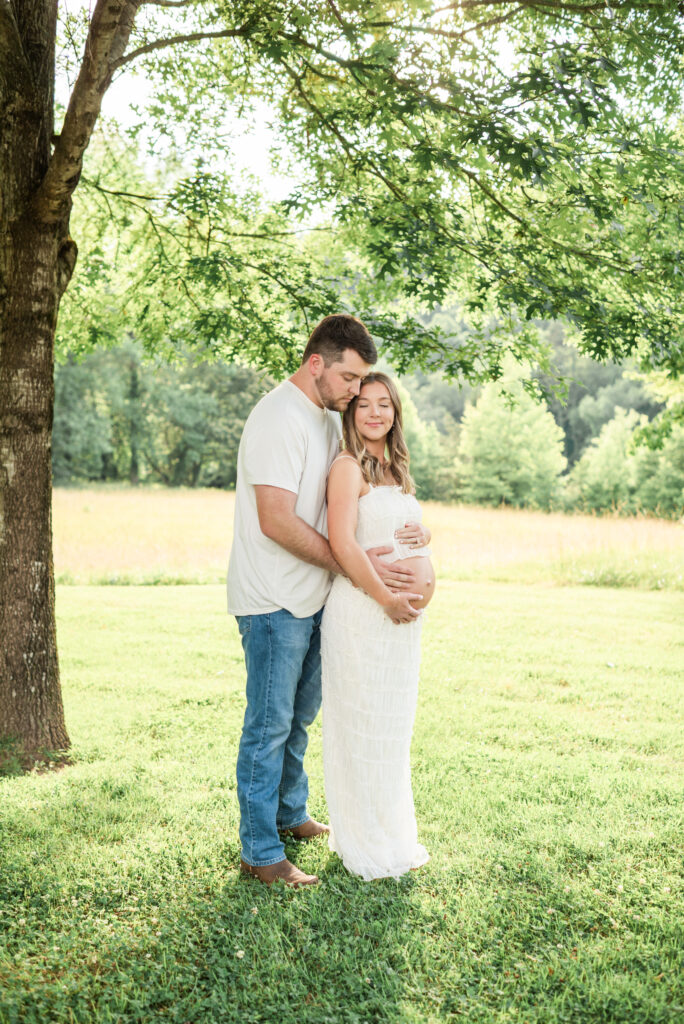 Pregnant couple at golden hour during a maternity session at Lakeshore Park in Harriman, TN