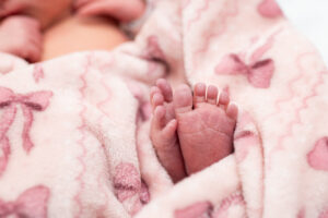 Close-up of newborn baby's feet during Fresh 48 hospital photo session