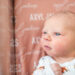 Newborn baby with eyes wide open in hospital bassinet during Fresh 48 session