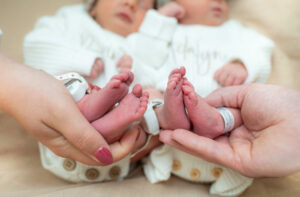Close-up of twin newborn babies' feet during hospital Fresh 48 session